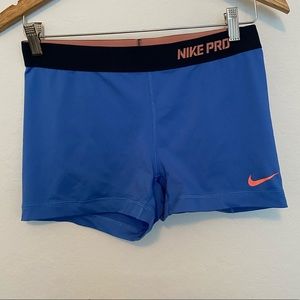 Blue and peach Nike workout shorts